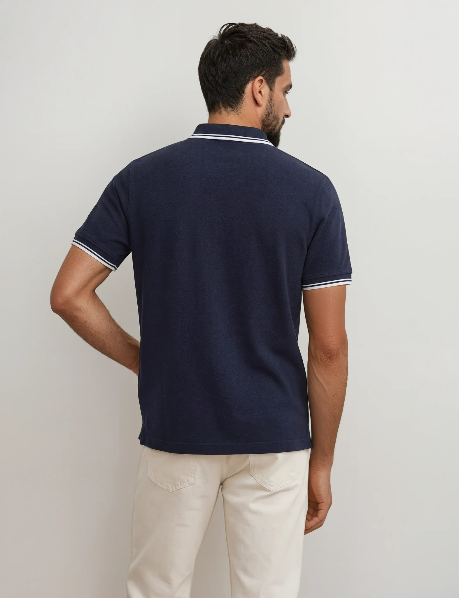 polo azul marino hombre algodón origen studio vista trasera